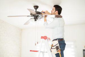 Man doing a Ceiling Fan Installation